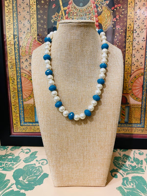 PEARL STRING WITH BLUE STONE